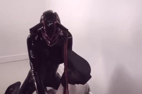 tranny In Latex bangs Her slave lad