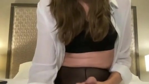 Slim Brunette American Shemale In Black Pantyhose Strokes Her Big Dick